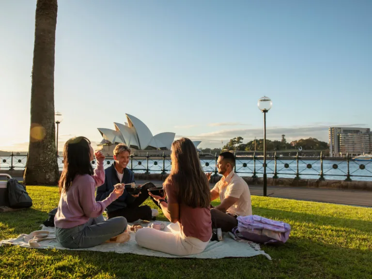Young people enjoying a picnic at Hickson Reserve in Sydney