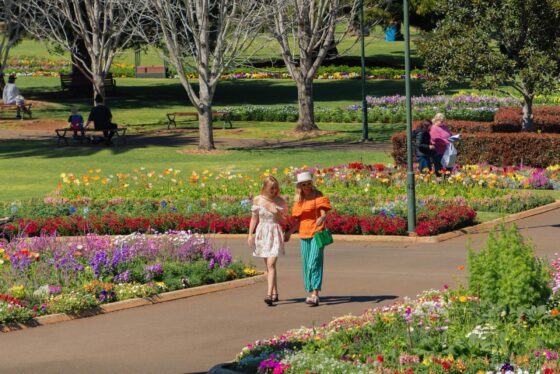 Women walking in Queens Park. Image credit: TEQ